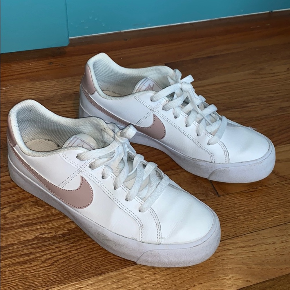 Like New white Nike’s with rose swoosh (SOLD)
